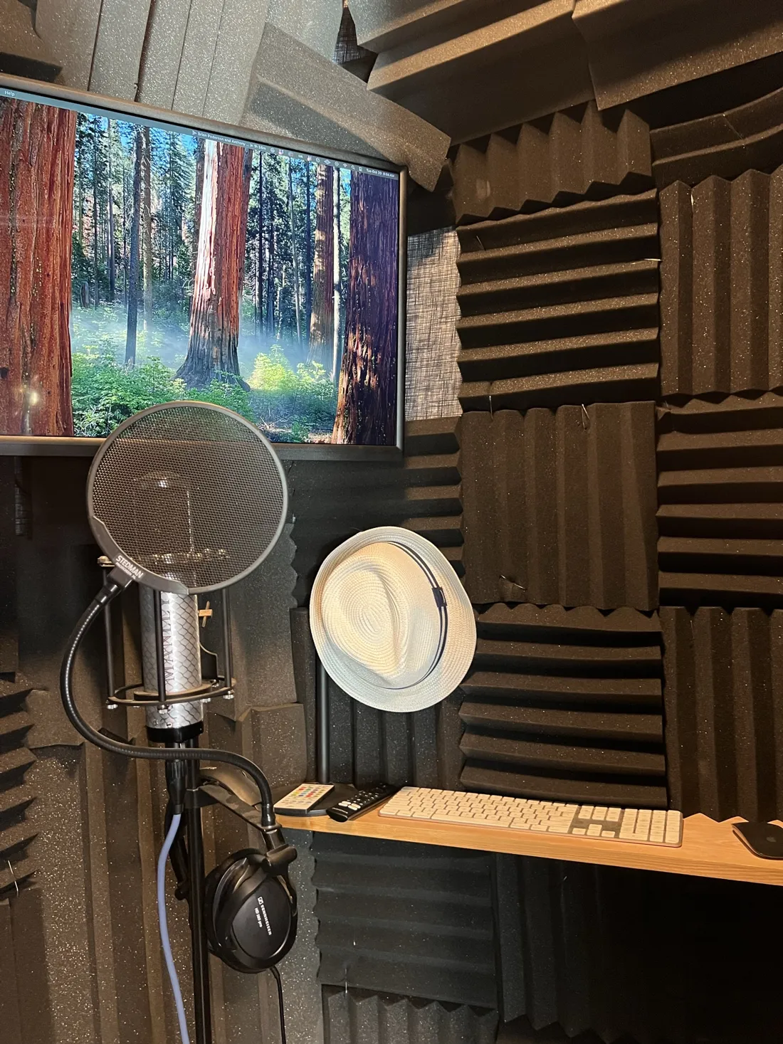 The recording booth: microphone, script screen and desk